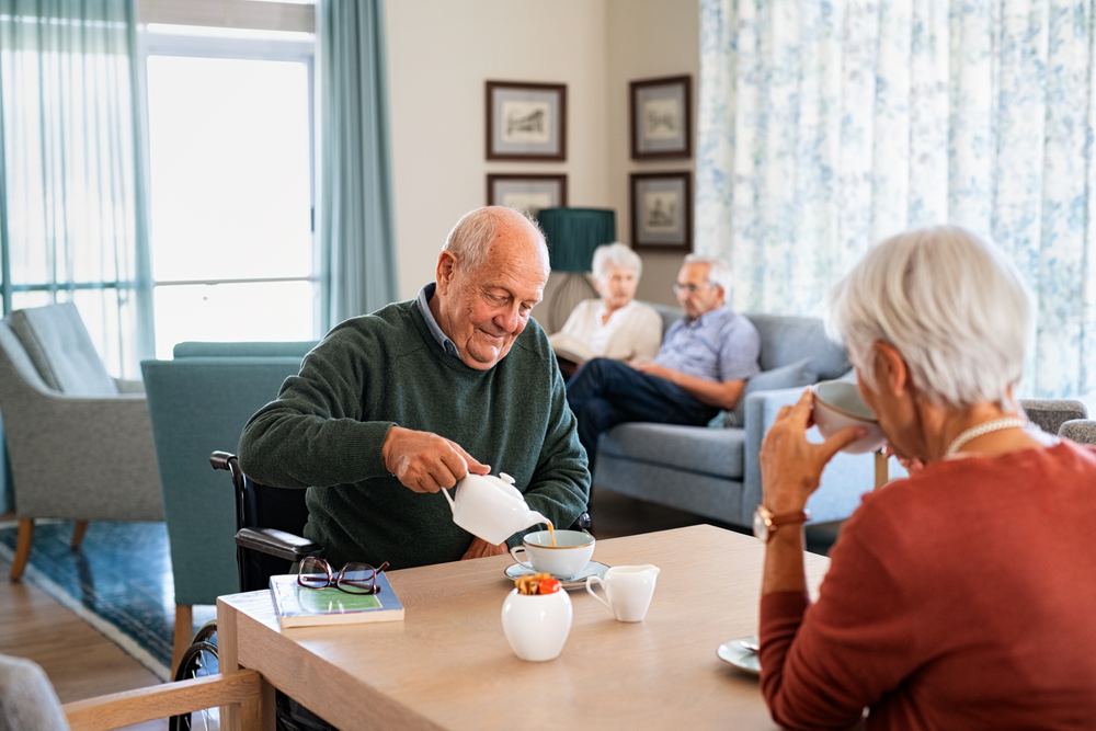 Senior man pouring tea cup